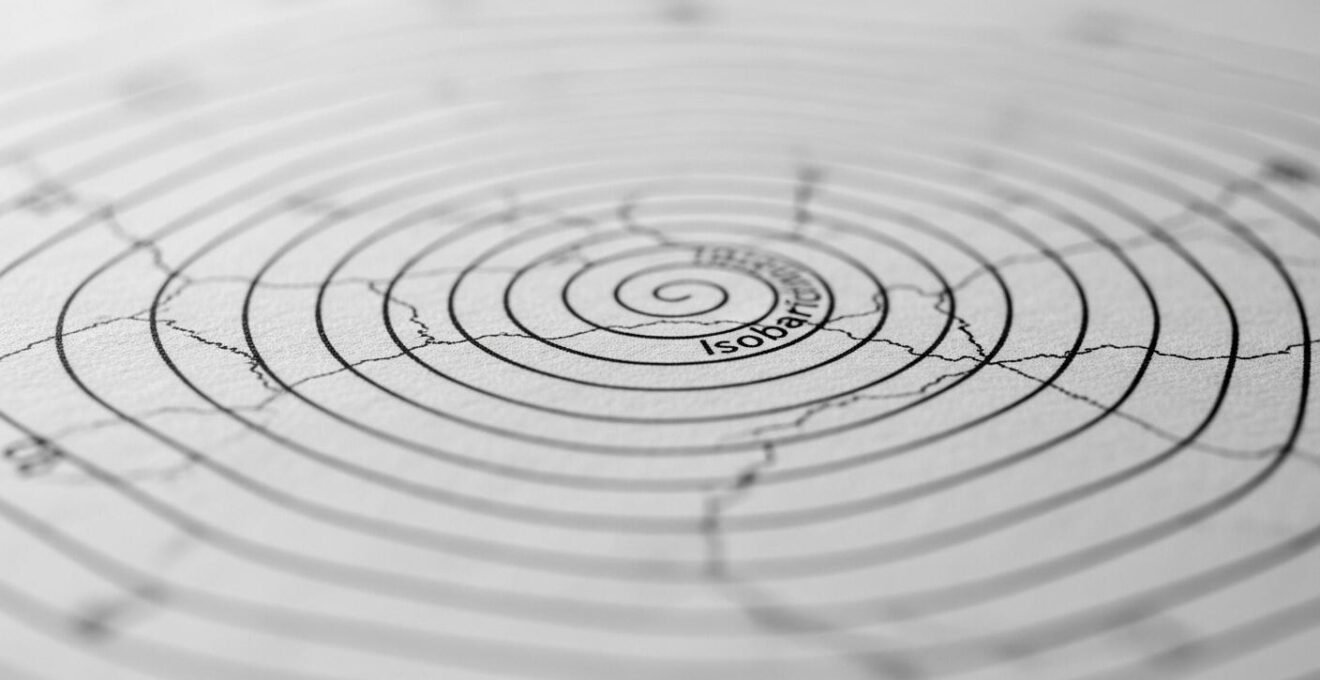 Carte isobarique schématique avec lignes d’isobares illustrant la circulation du vent et les variations de vitesse